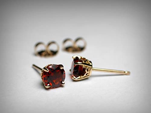 Genuine garnet stud earrings in solid 14K yellow gold in a filigree, vintage style mounting. The birthstone for January.