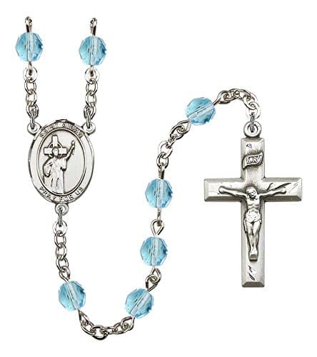 Silver Plate Rosary features 6mm Aqua Fire Polished beads. The Crucifix measures 1 3/8 x 3/4. The centerpiece features a St. Aidan of Lindesfarne medal.