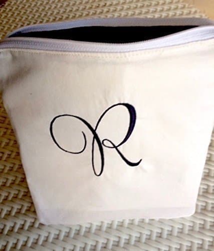 Bridesmaid gift purse includes personalization with custom colors option.