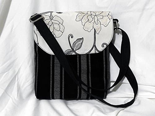 Designer fabric crossbody bag. Adjustable right shoulder strap.