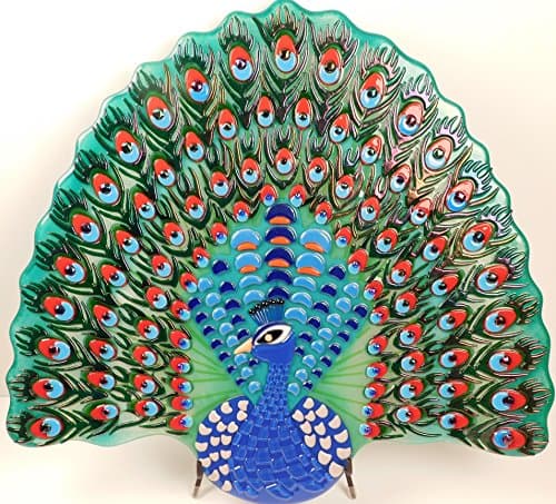 A wall mounted fused glass art object "A Peacock"