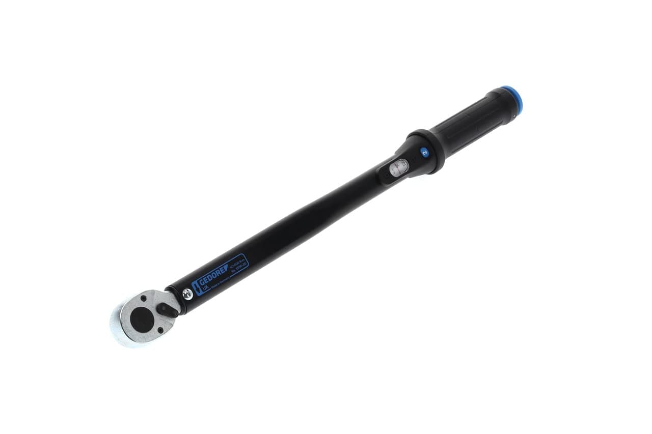 Torque wrench with reversible ratchet.