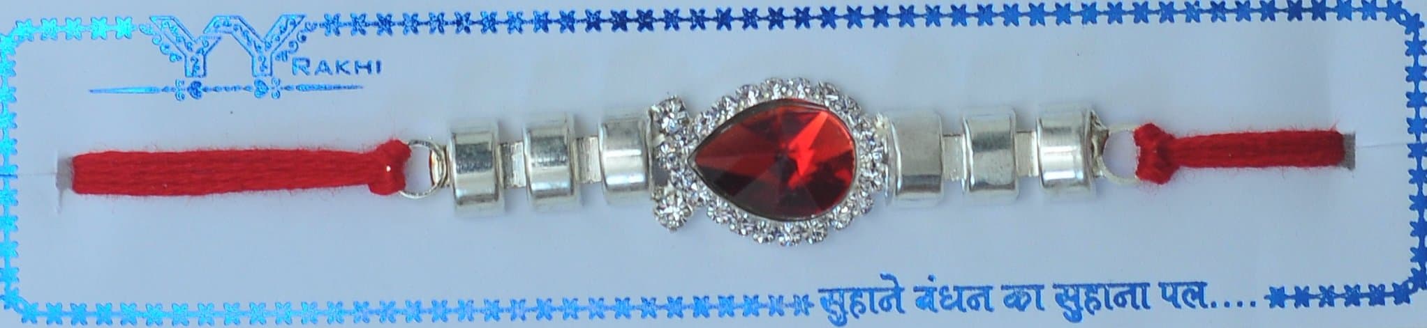 Fancy rakhi with thread, white pearl, silver diamonds and colourful stons design ED10527