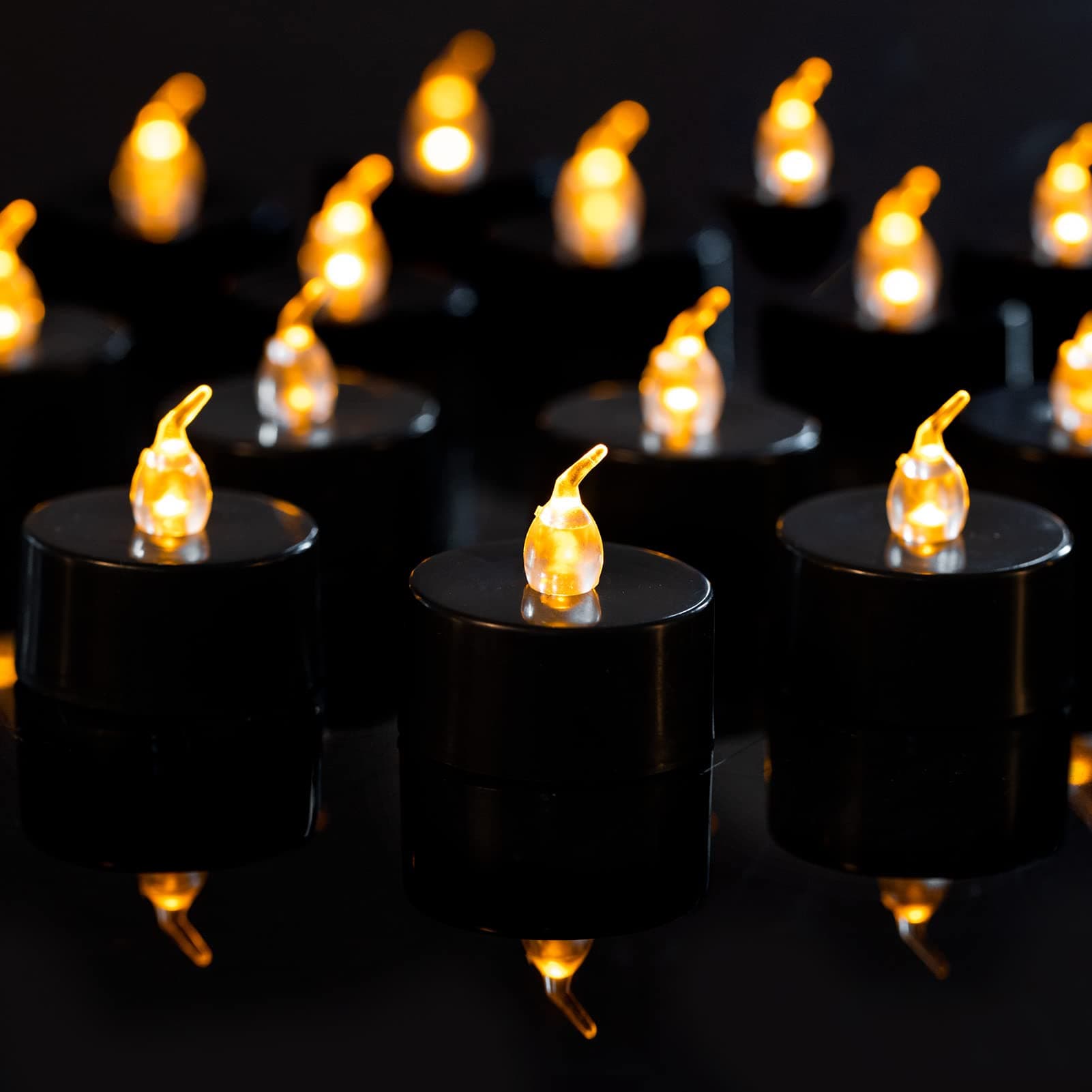 LANKER 24 Pack Black Tea Lights Candles, Flickering Warm Yellow Flameless LED Tealights, Long Lasting Battery Operated Fake Candles, Decoration for Wedding, Halloween and Christmas